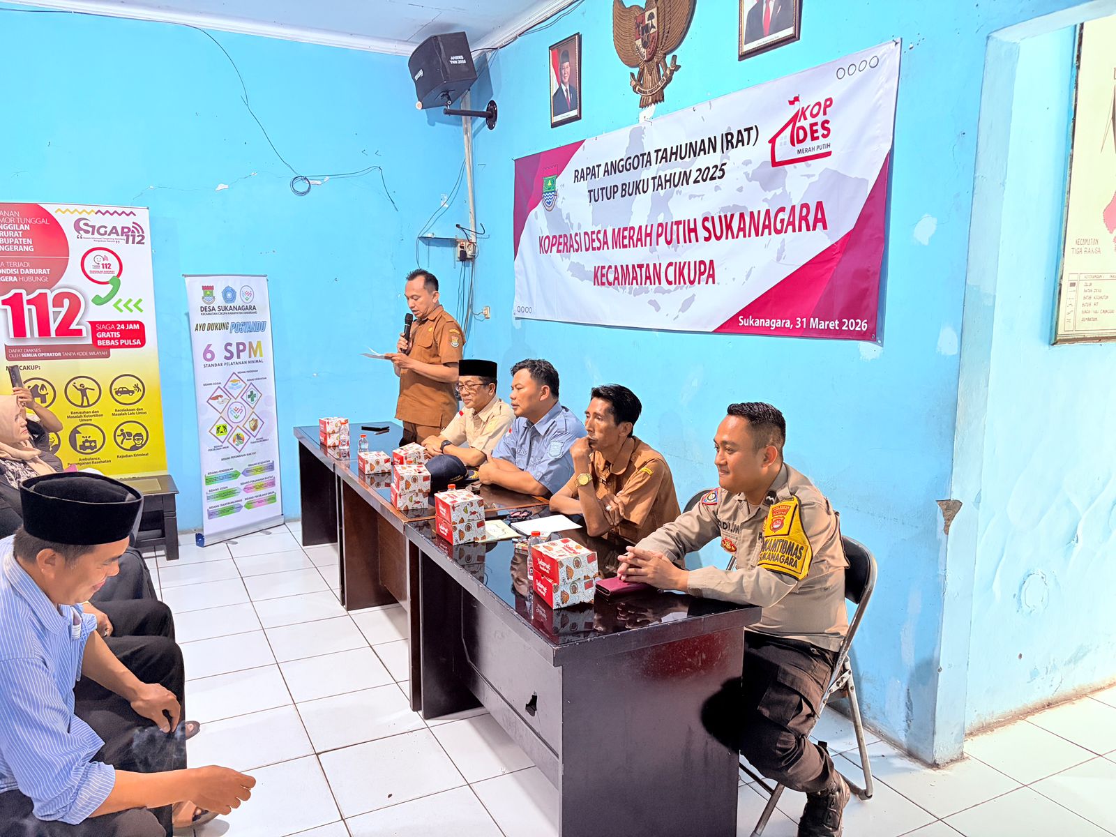 Bhabinkamtibmas Desa Sukanagara Hadiri Rapat Anggota Tahunan Koperasi Merah Putih