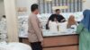 IMG-20260520-WA0055 Bhabinkamtibmas Polsek Cikupa Amankan Penyaluran Bantuan Beras dan Minyak Goreng di Desa Bojong